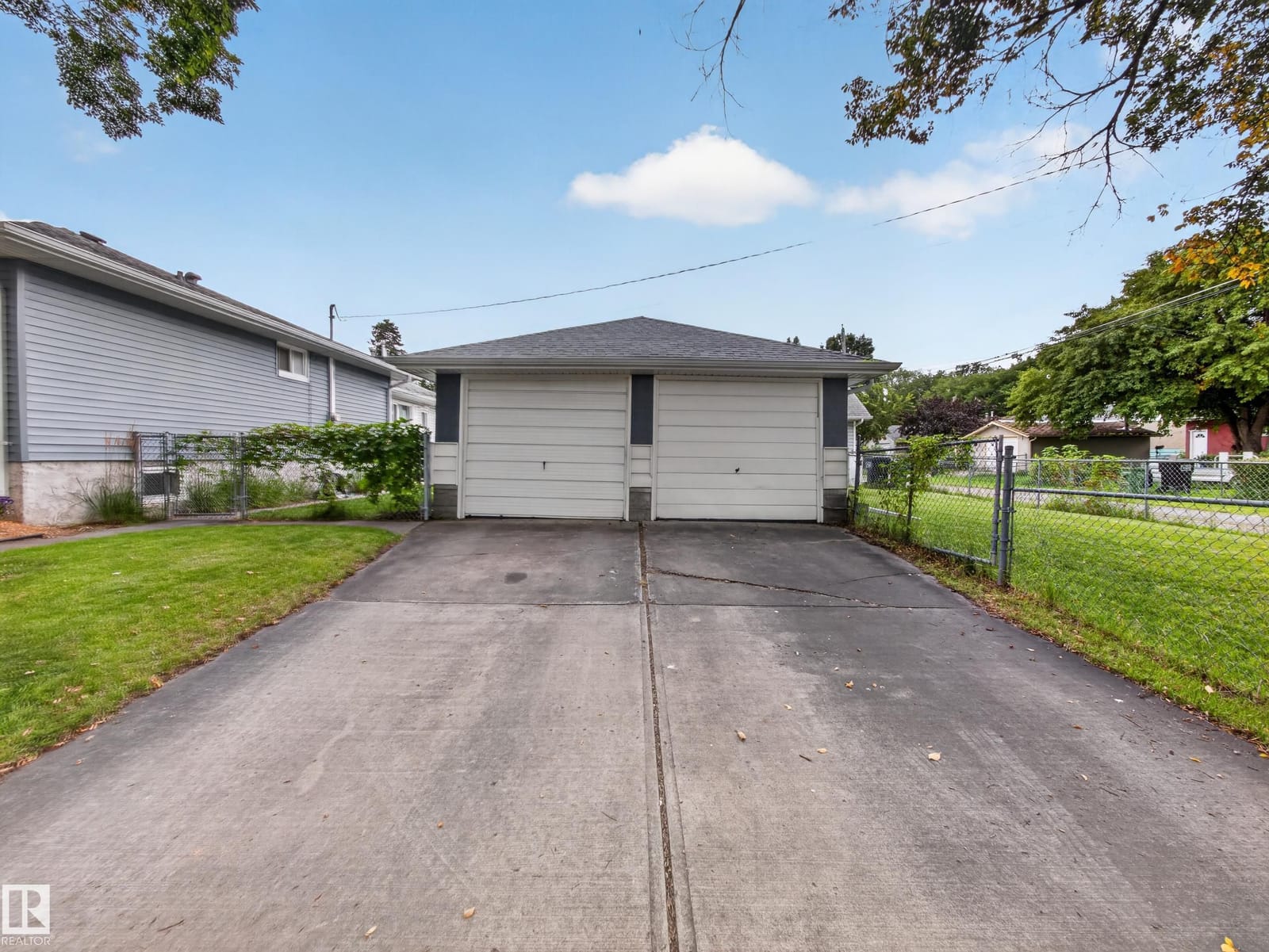 Double detached garage and paved driveway