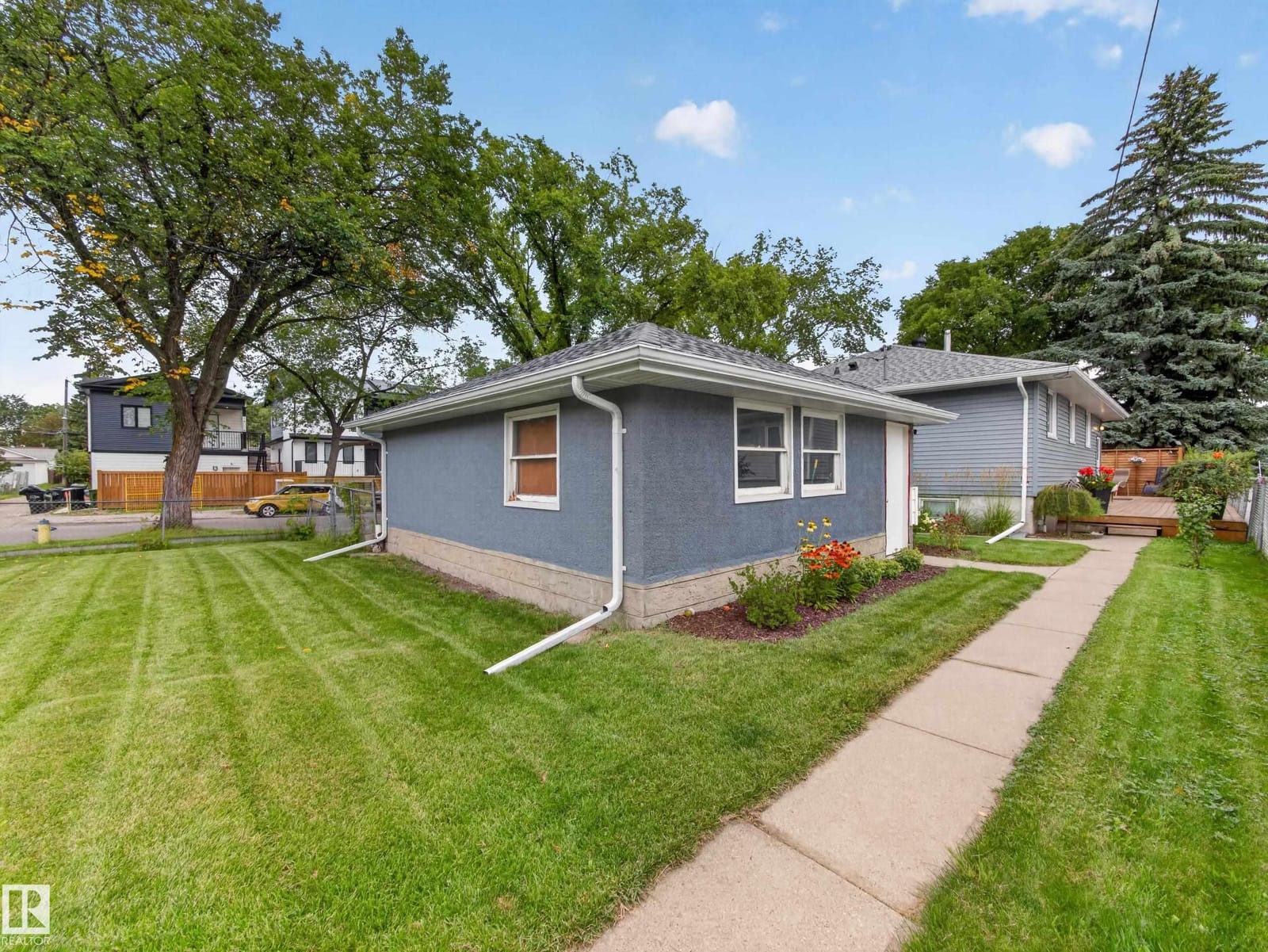 Front and side elevation with lawn and walkway