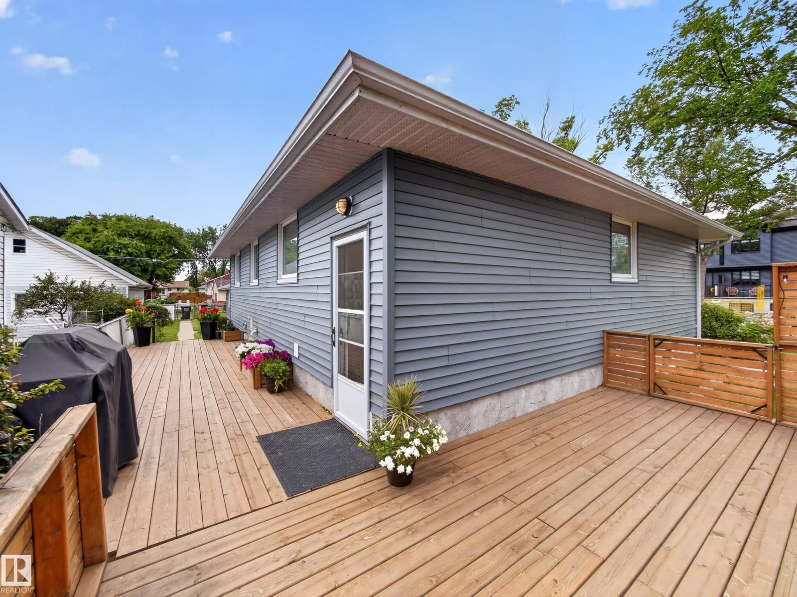 Deck with barbecue area and house corner