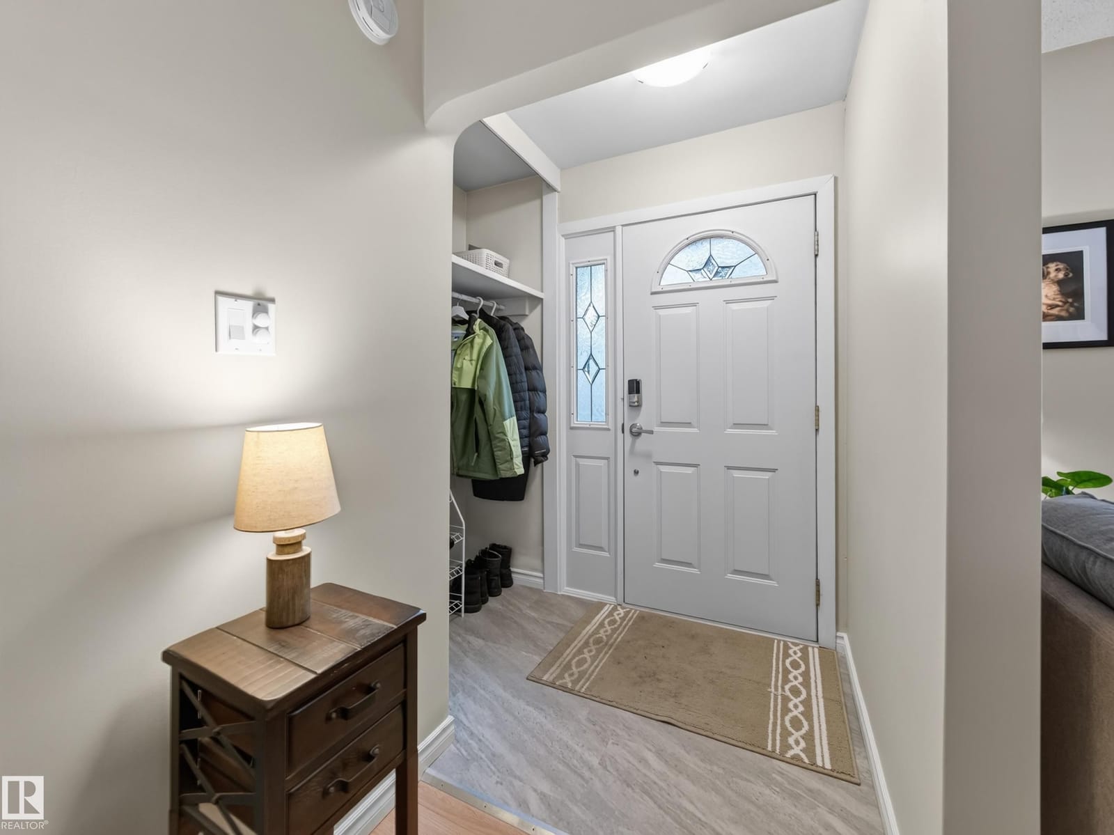 Front entry foyer with closet and glass-panelled door