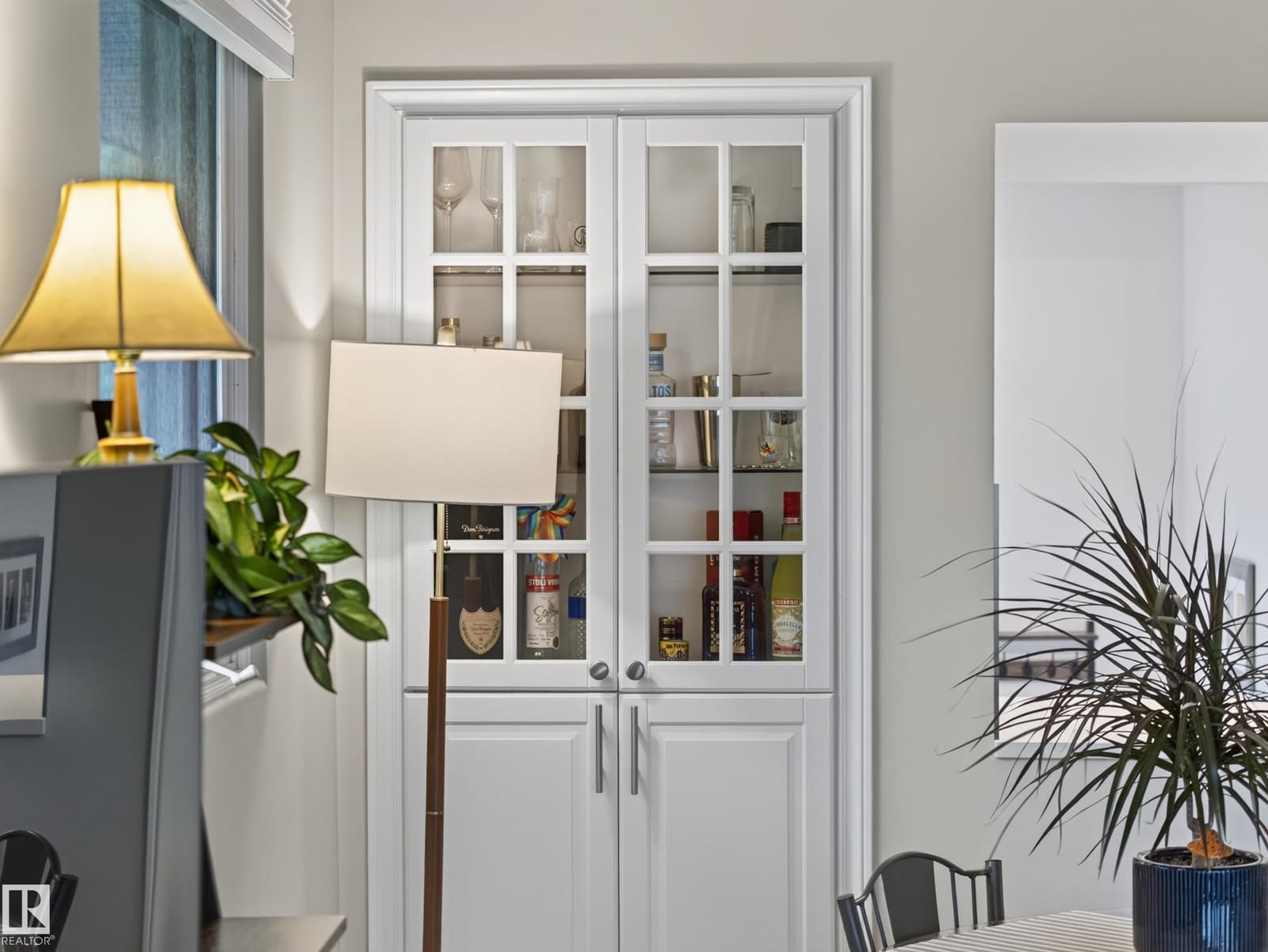 Glass-panelled interior doors and built-in cabinet