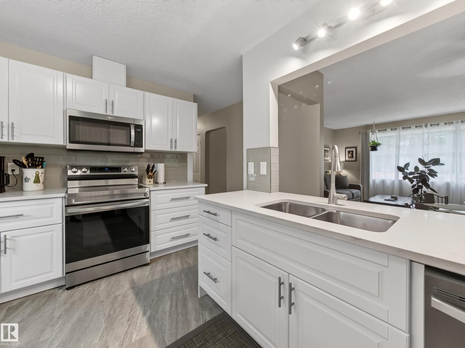 Kitchen with stainless range and microwave