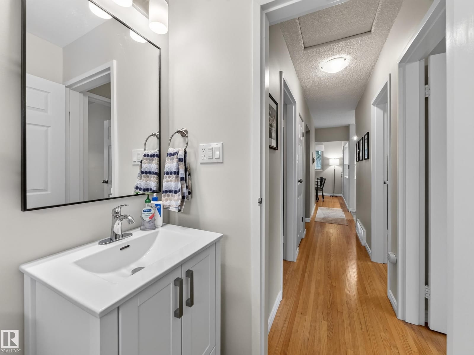 Bathroom vanity with the hallway beyond