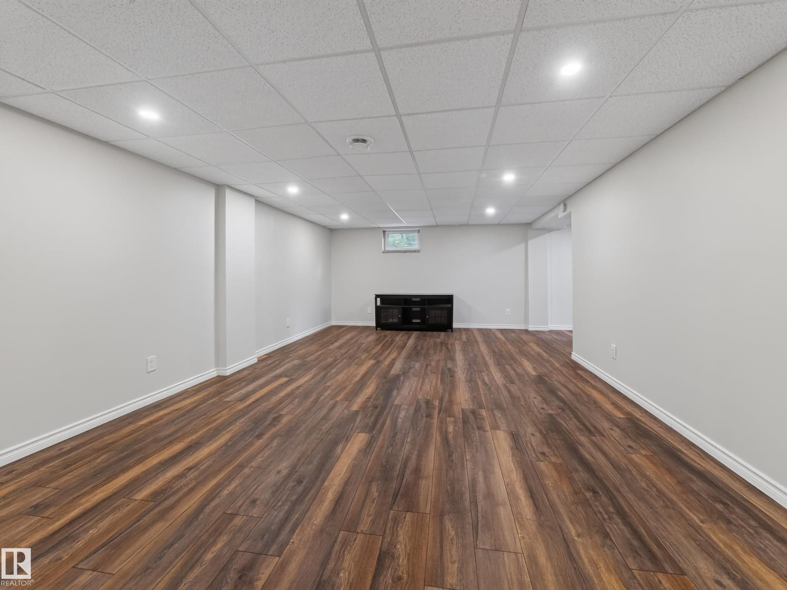 Lower level recreation room with pot lights