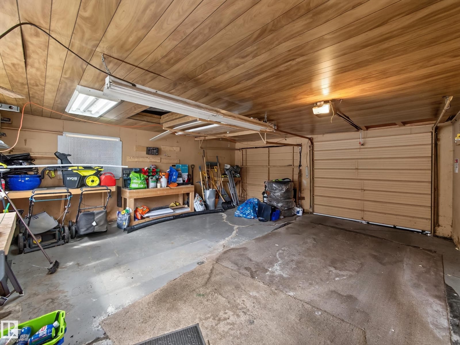 Double detached garage interior with workbench