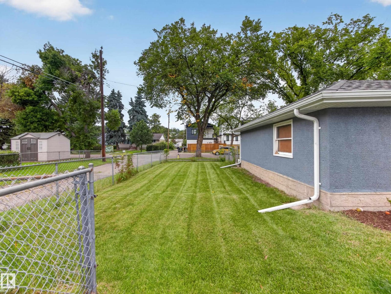 Fenced back yard and lawn