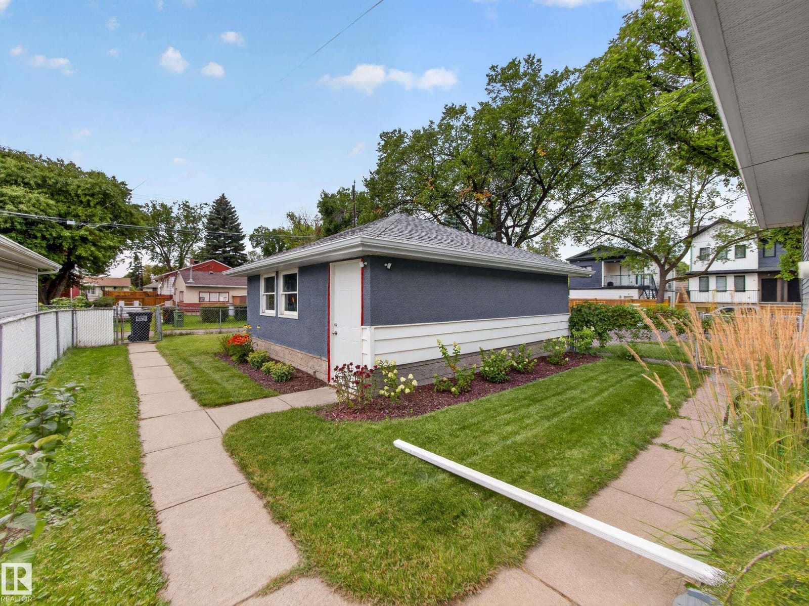 Back yard with lawn and mature trees