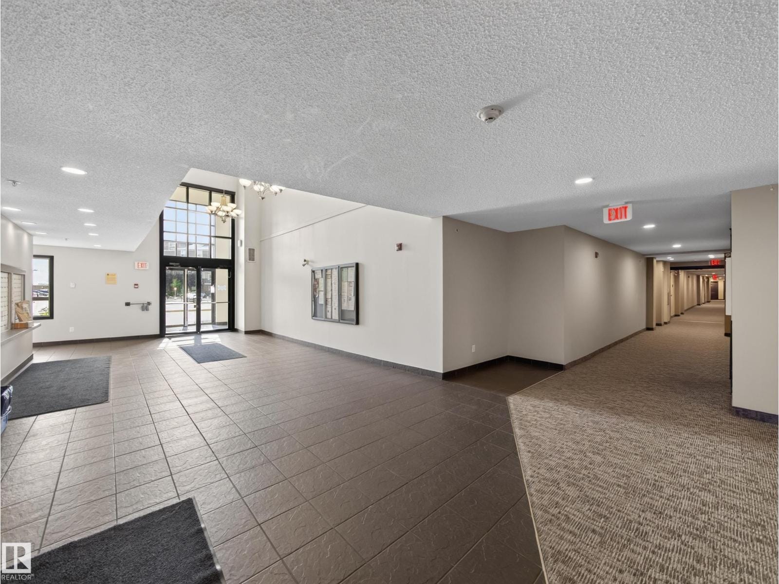 Lobby seating area with tile and carpet