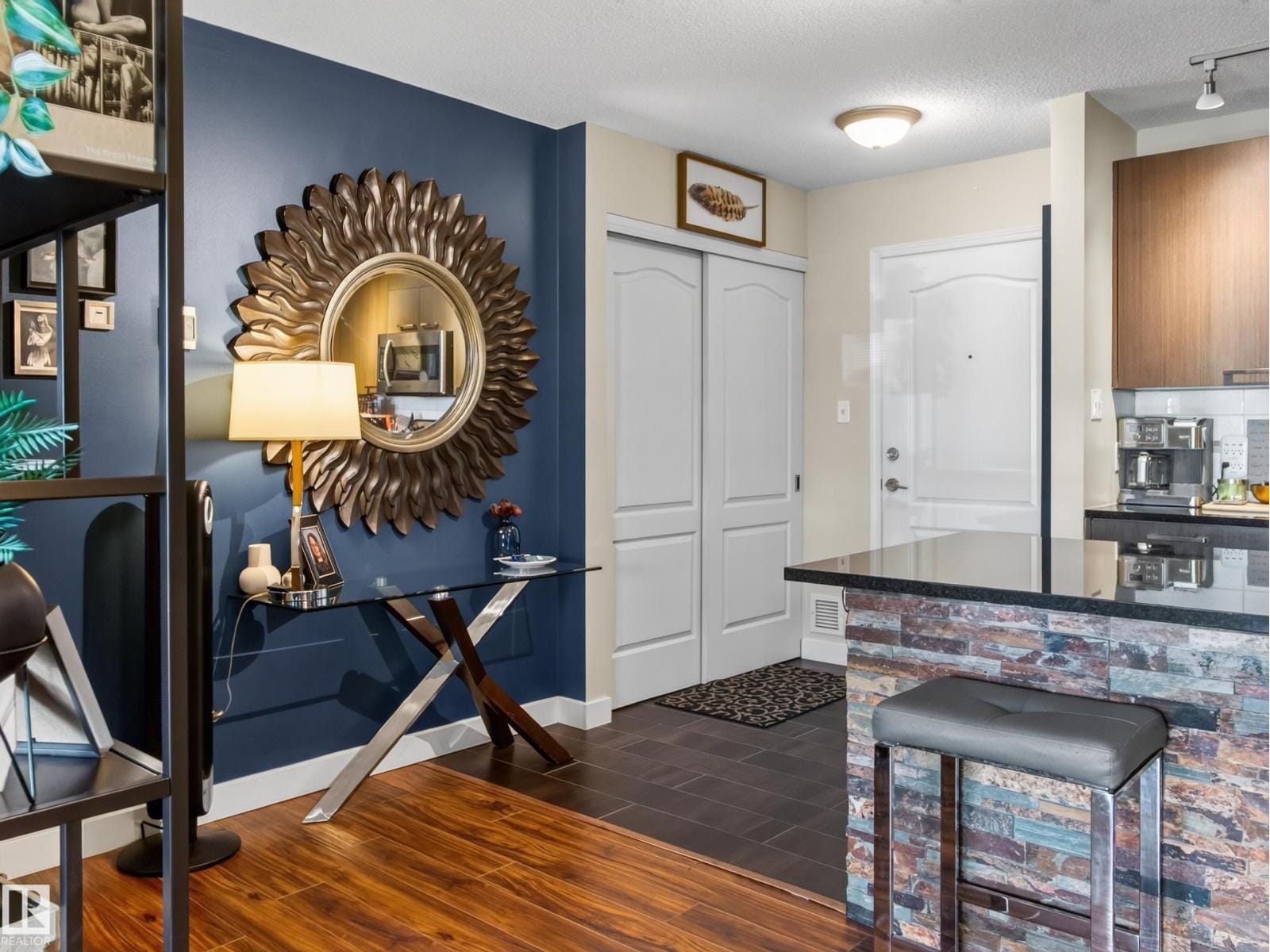 Entry with console table and mirror looking through to the kitchen