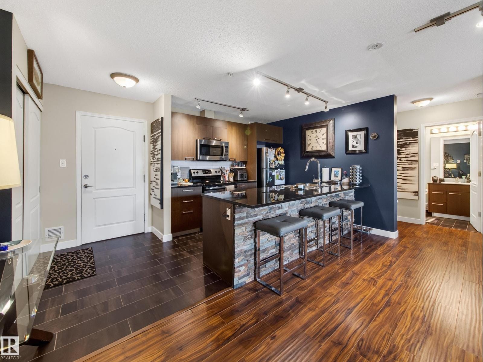 Entry looking into the kitchen and island seating
