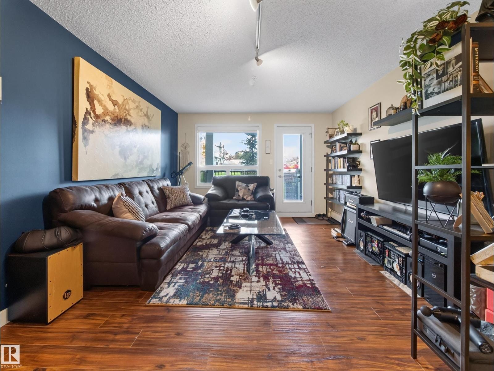 Living area with sofa and media wall