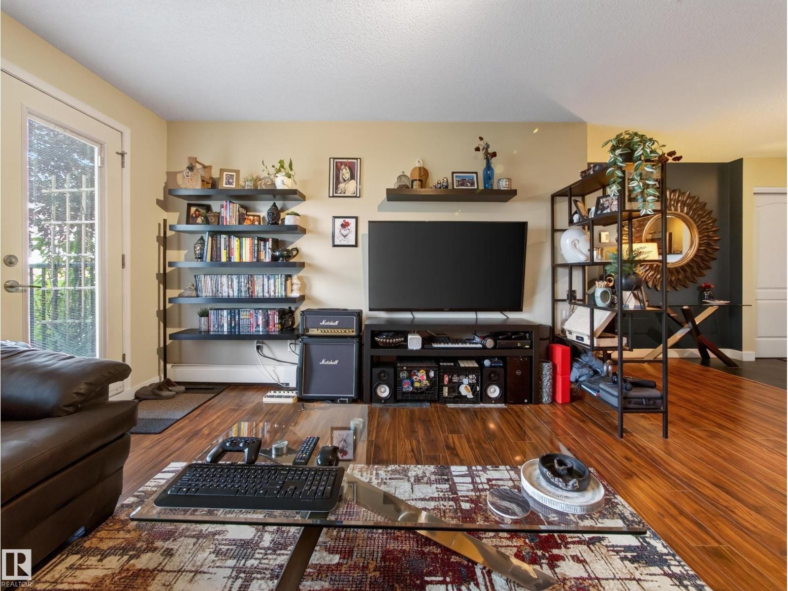 Living space with shelving and the patio door