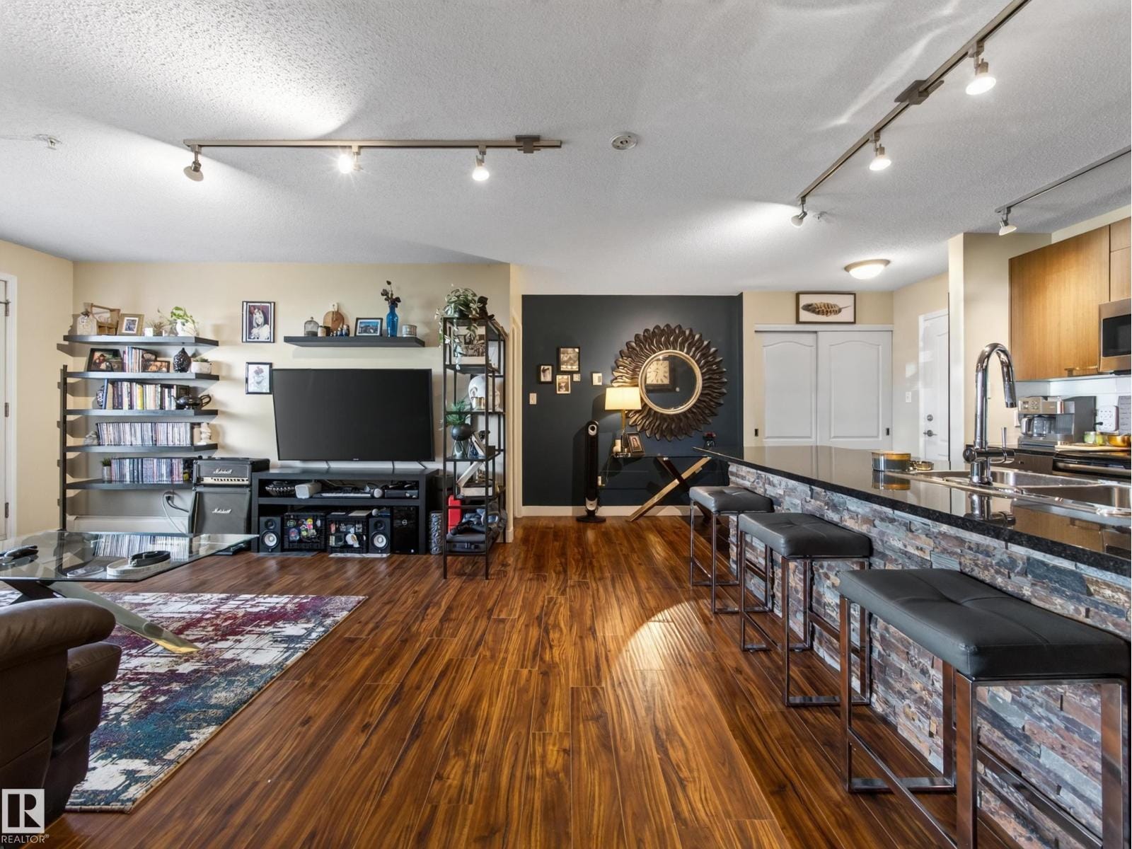 Living area with the island breakfast bar behind