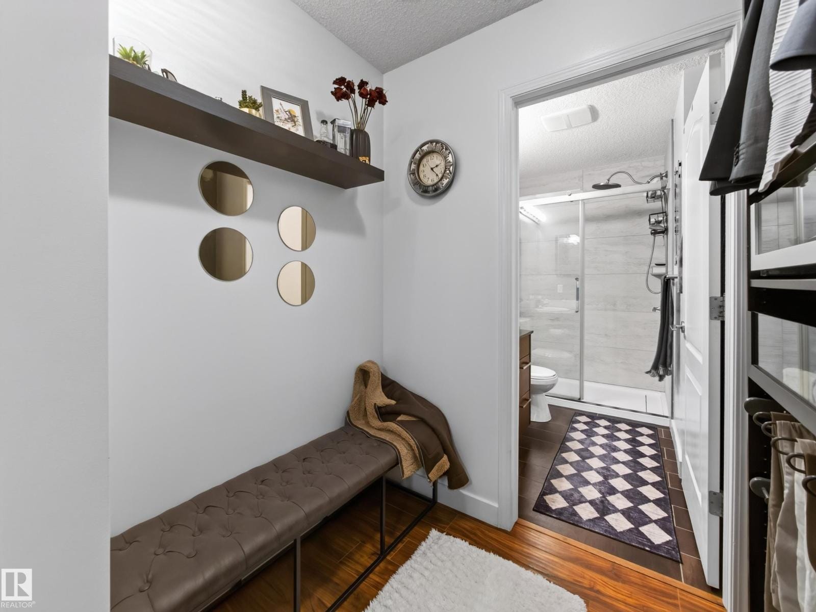 Ensuite with bench, floating shelf and glass shower