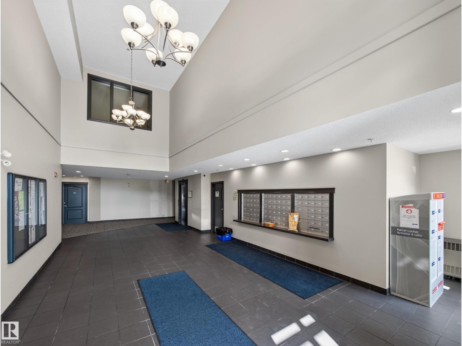 Building lobby with vaulted ceiling and mailboxes