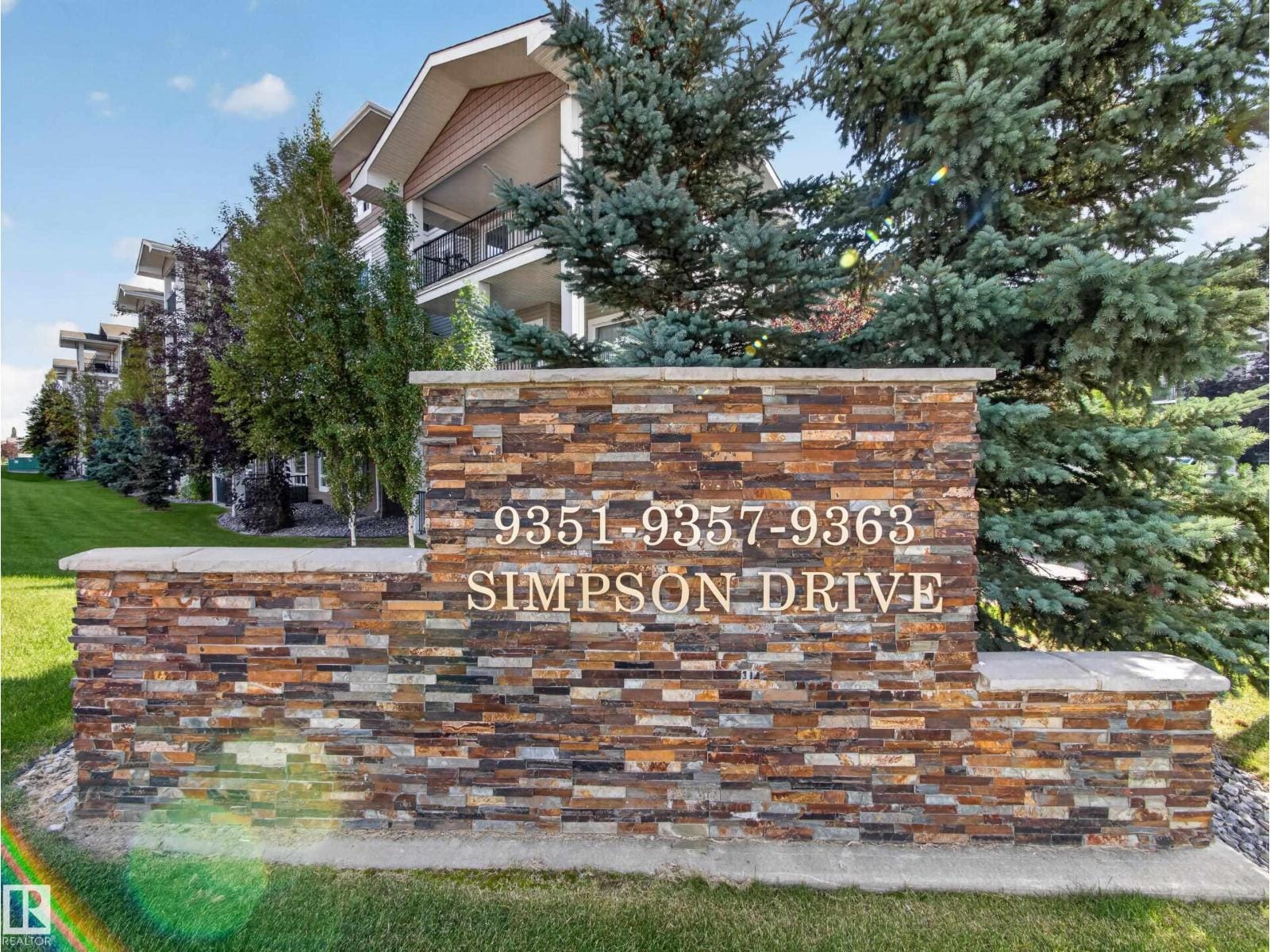 Stone entry monument for 9351, 9357 and 9363 Simpson Drive