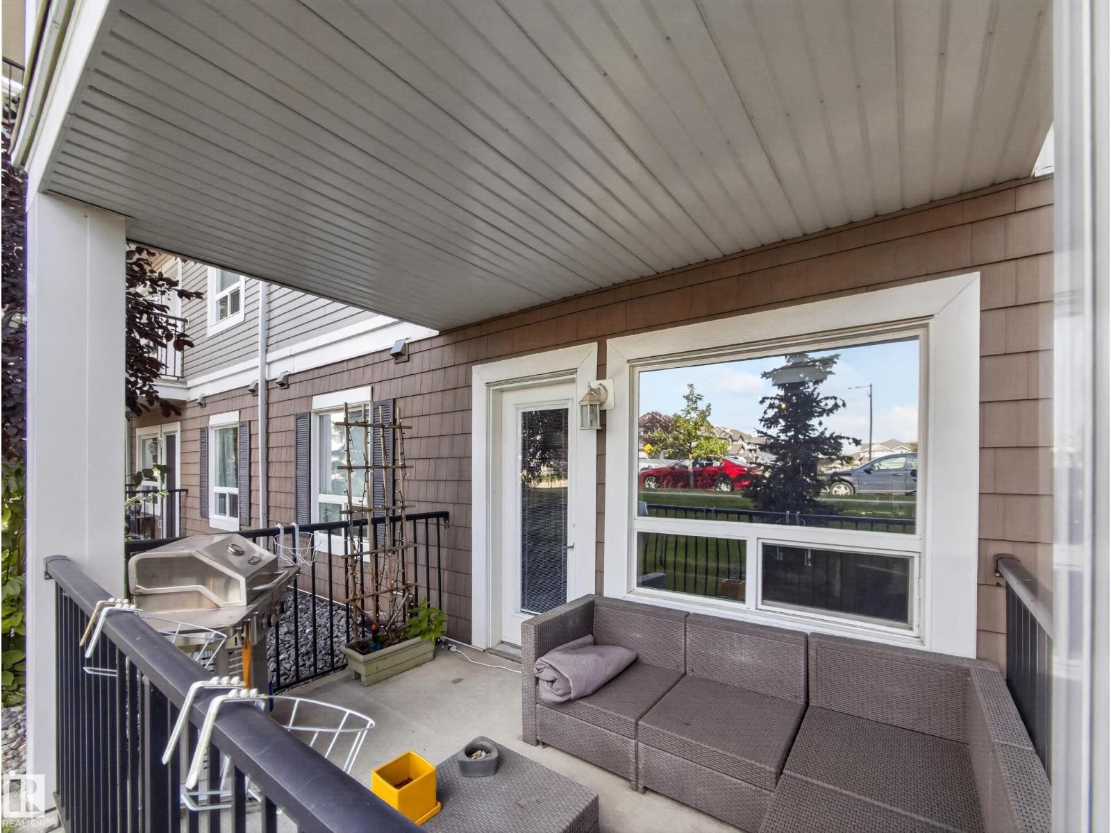 Covered patio seating beside the sliding patio door
