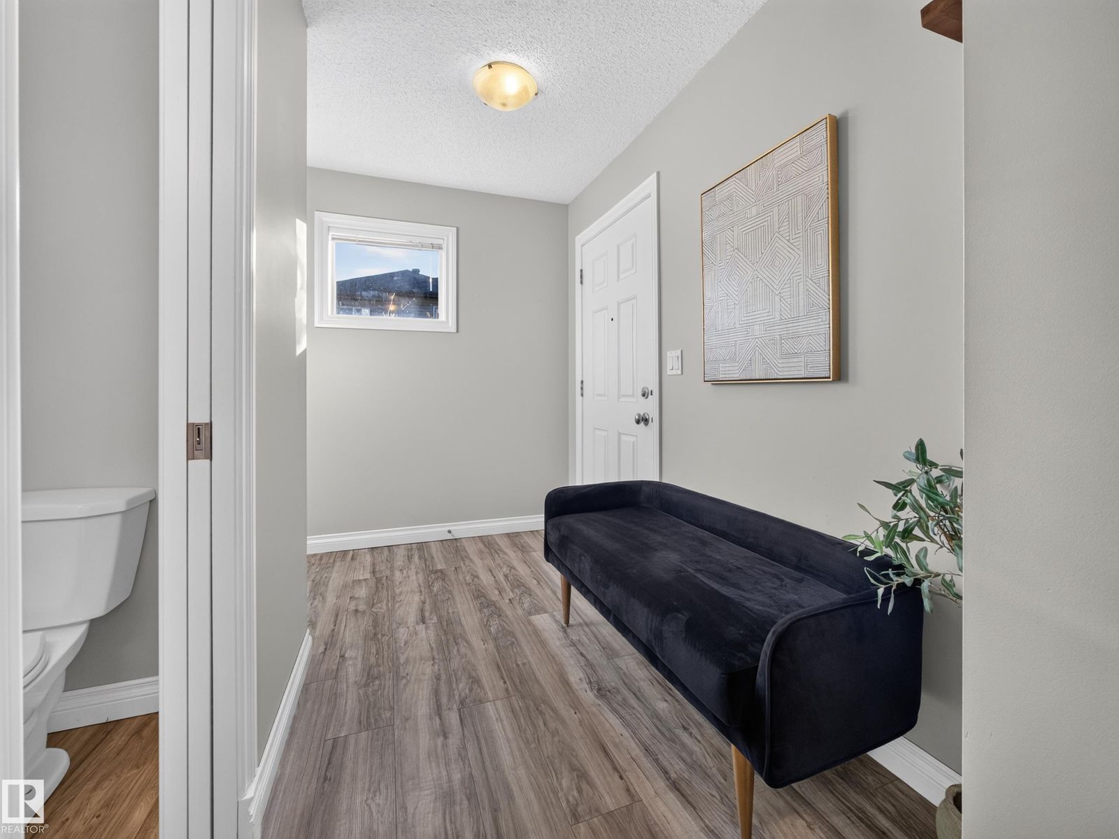 Entry foyer with bench and window