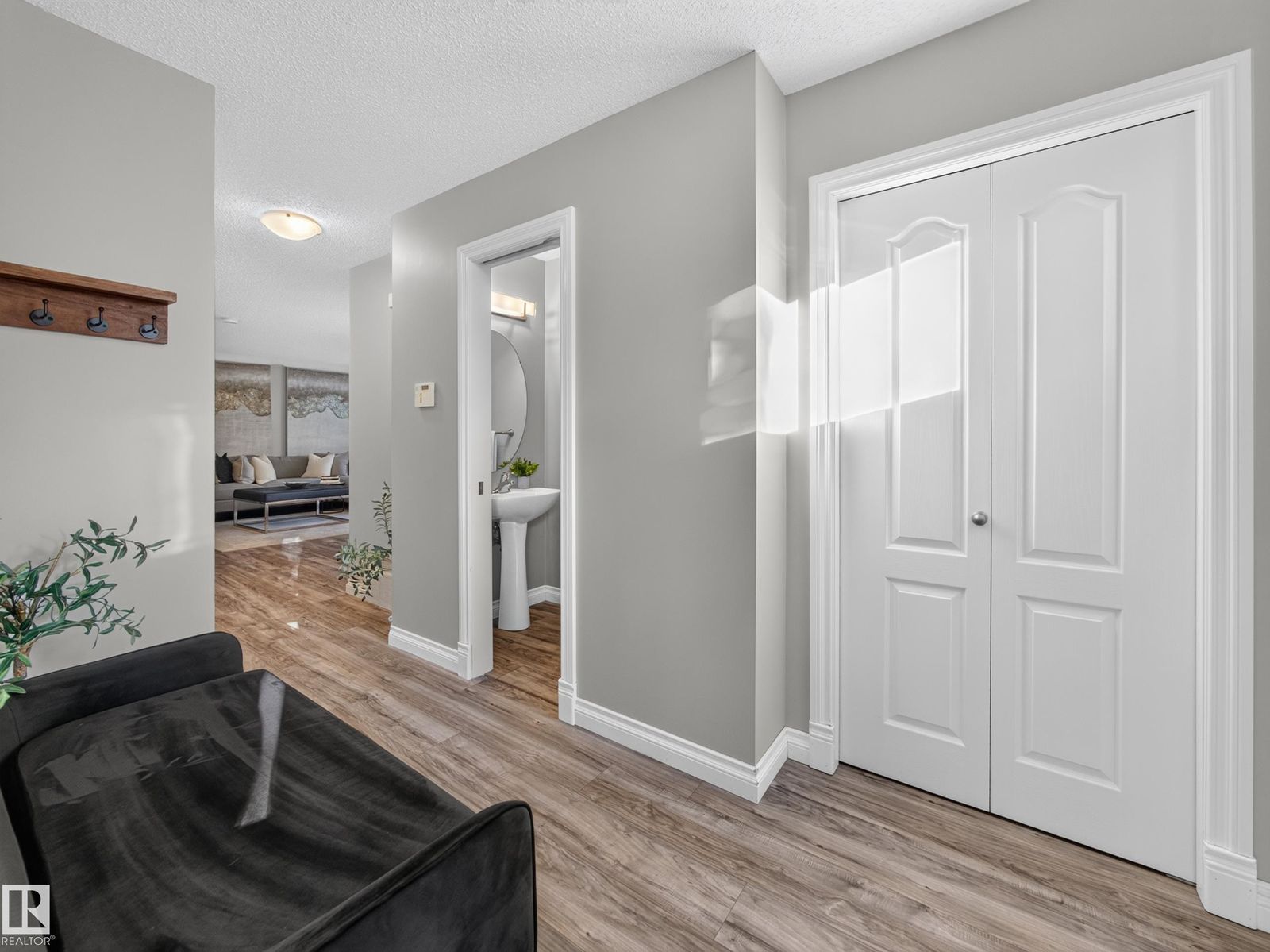 Entry hall with double closet and the powder room