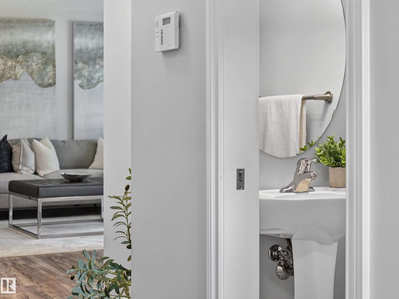 Powder room with a glimpse of the living room