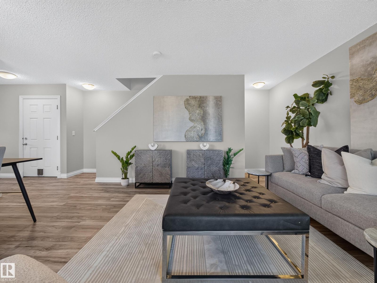 Living room toward the stairs and front entry