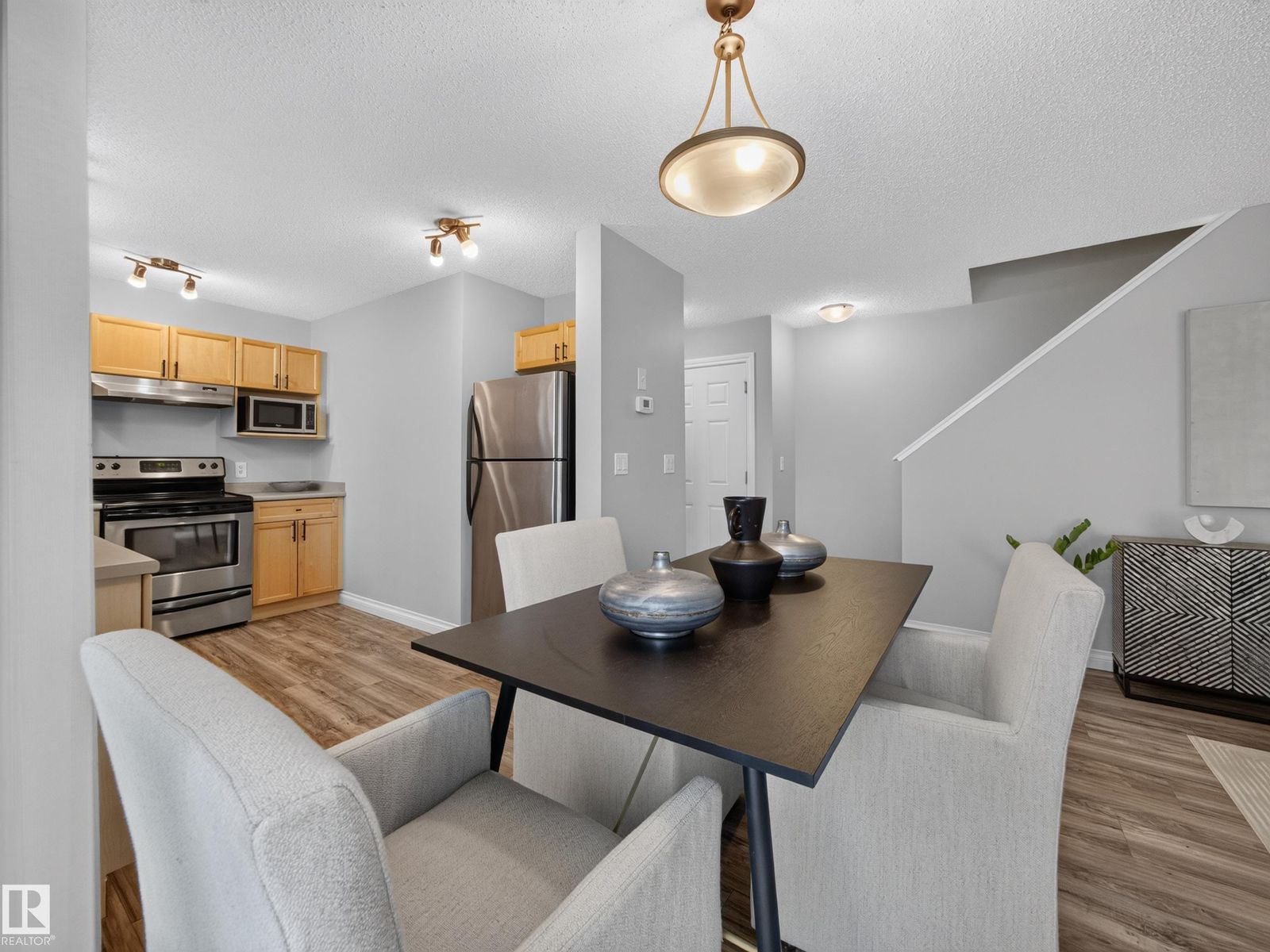 Dining area toward the kitchen and stairs