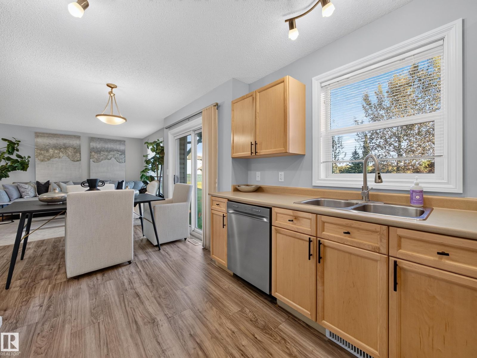 Kitchen and dining with the window over the sink
