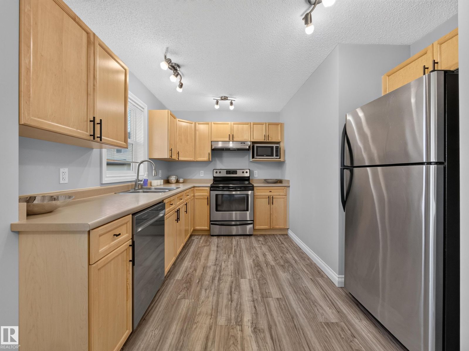 Kitchen with stainless fridge