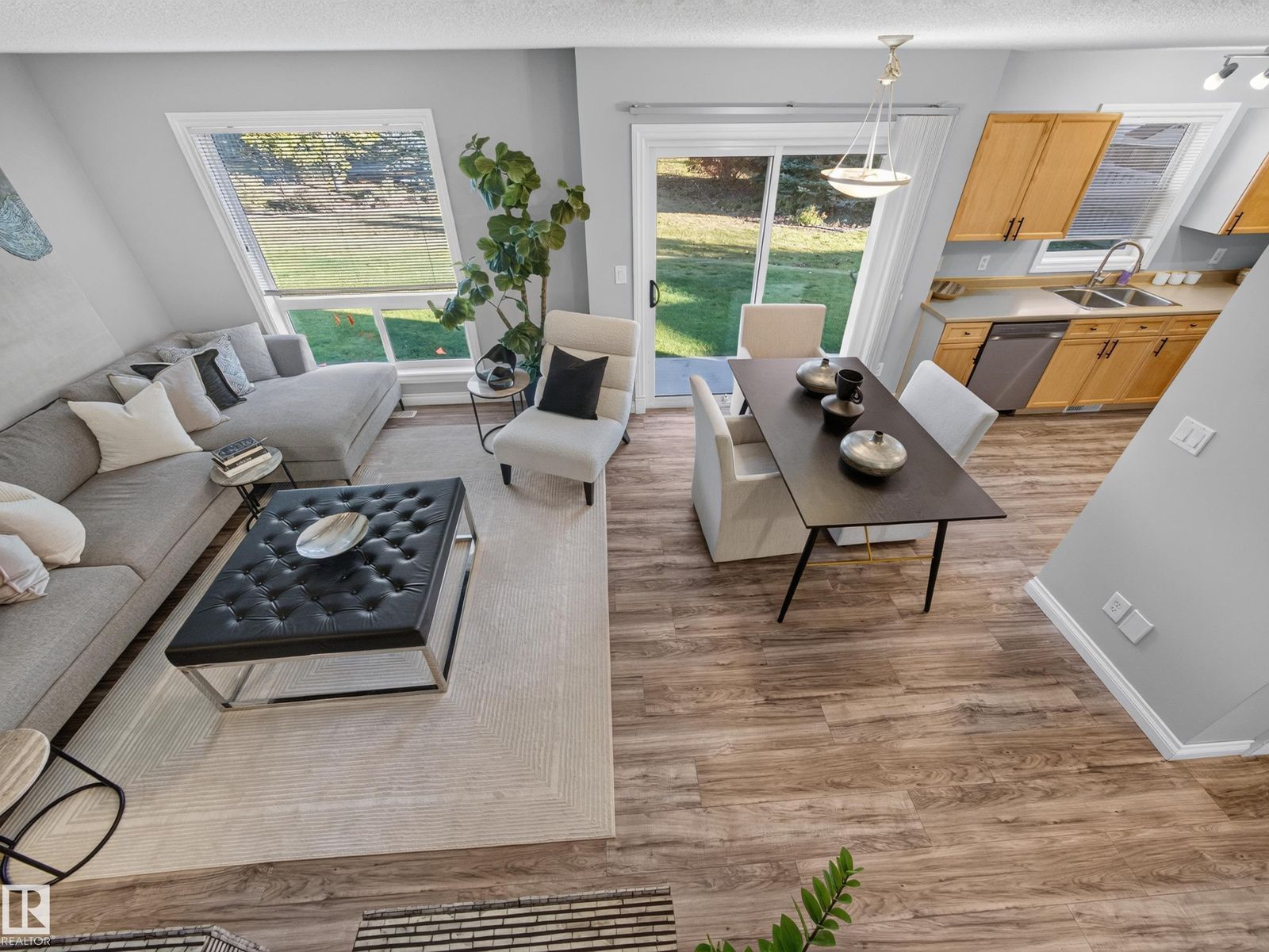 Open main floor: living, dining and kitchen with the patio door