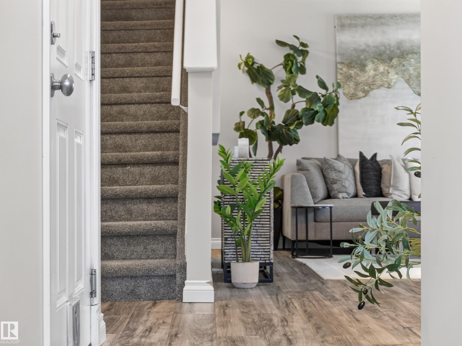 Stairs with the living room beyond