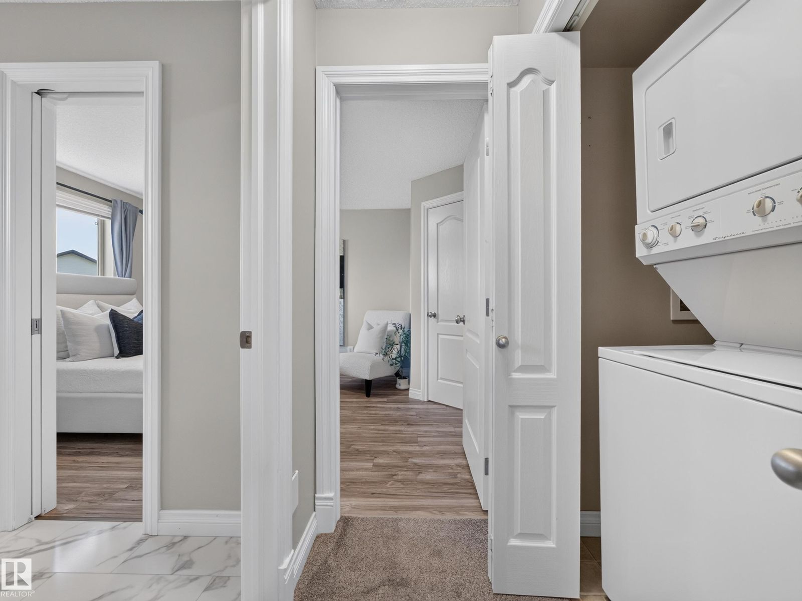 Upper hall with laundry and bedroom doors