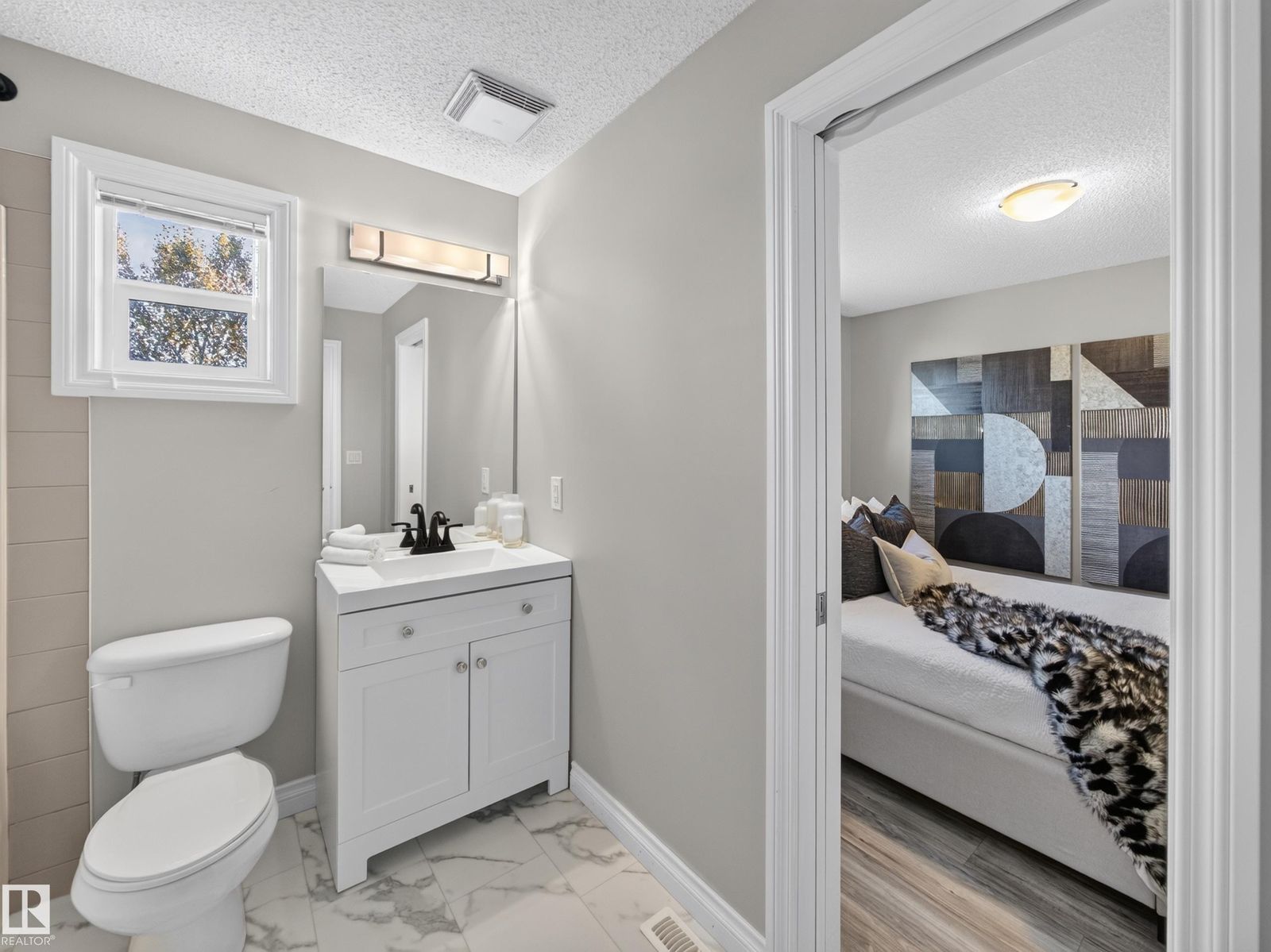 Bathroom with door through to the primary bedroom