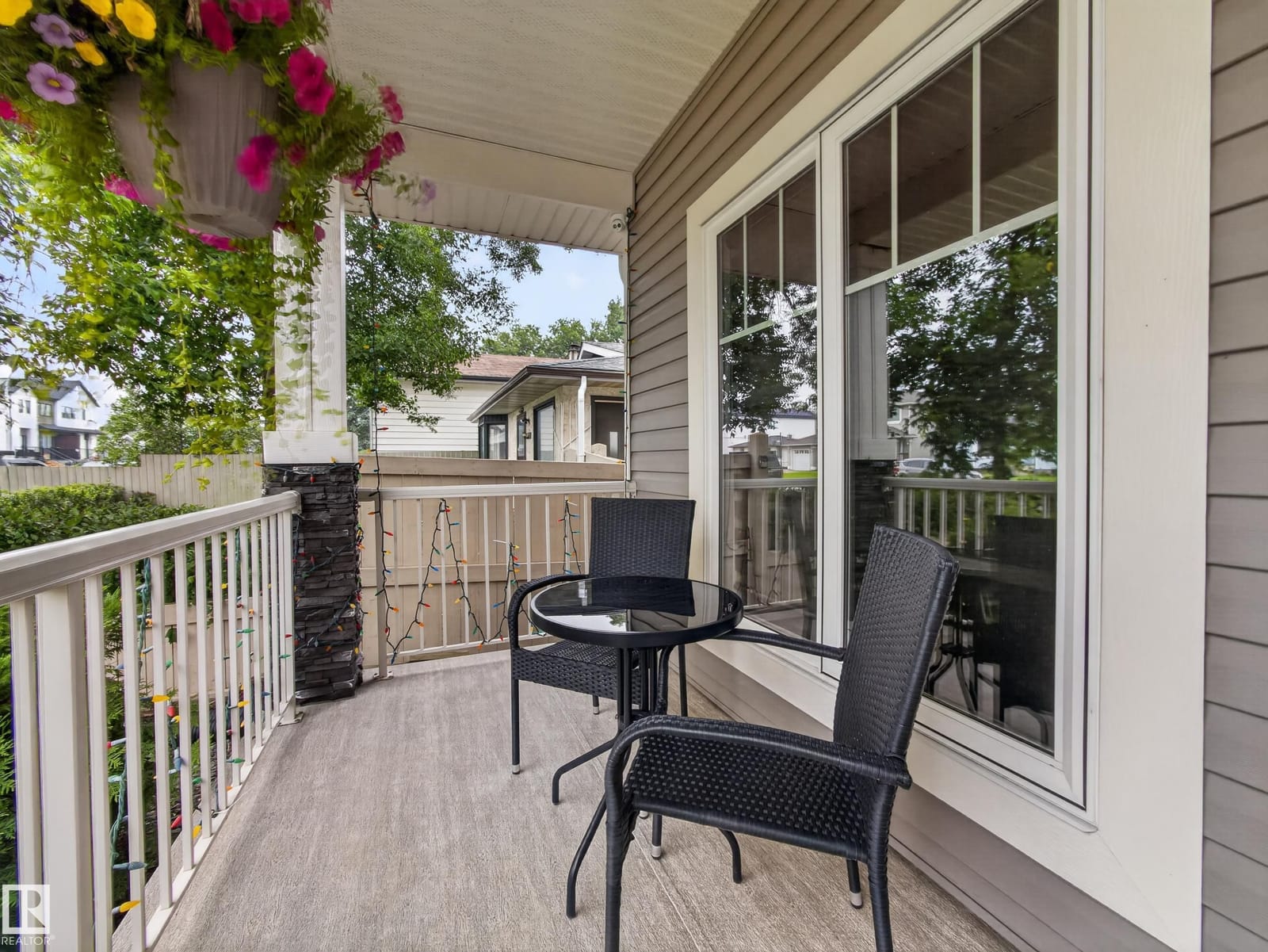 Covered front veranda with bistro seating