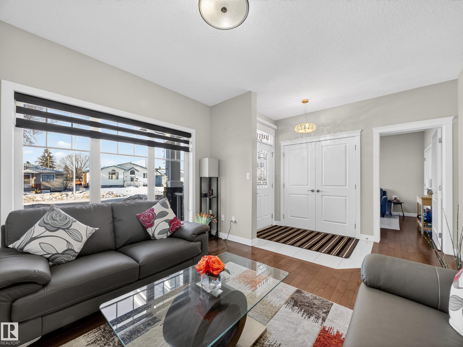 Front flex room with hardwood and a large window