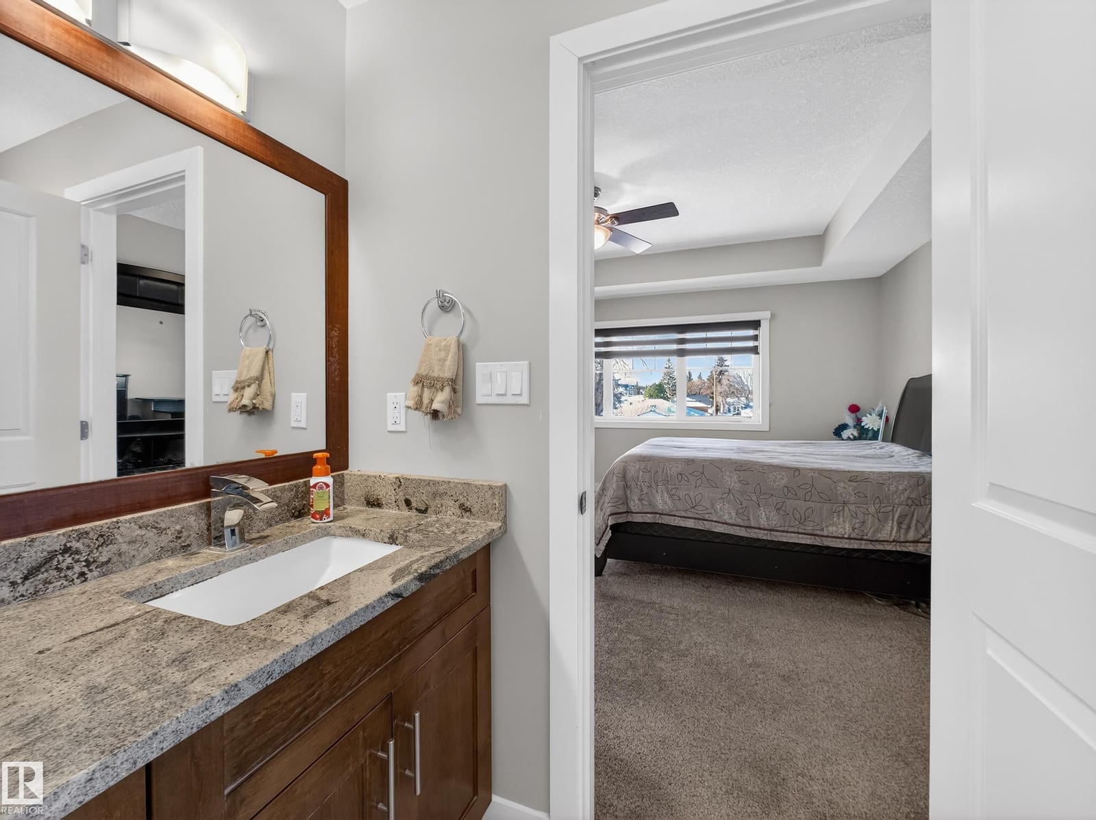 Bathroom vanity opening through to a bedroom