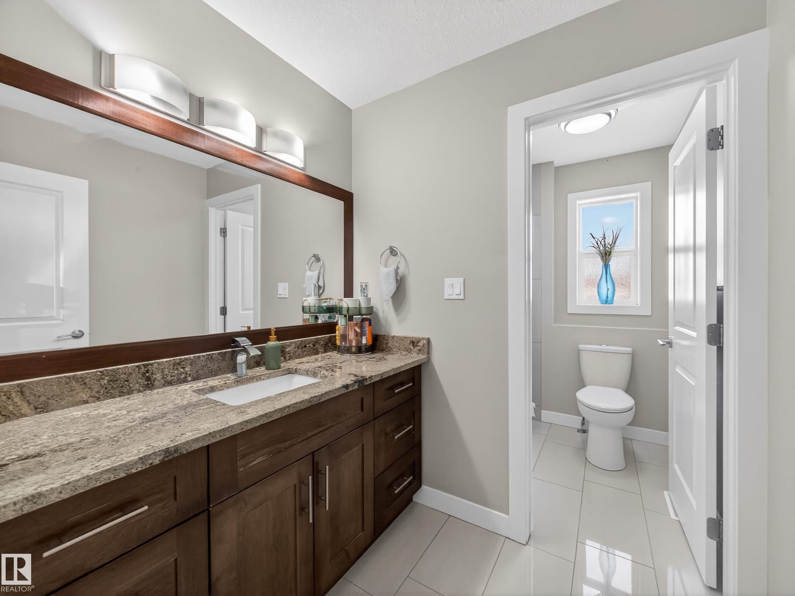 Full bathroom with granite vanity