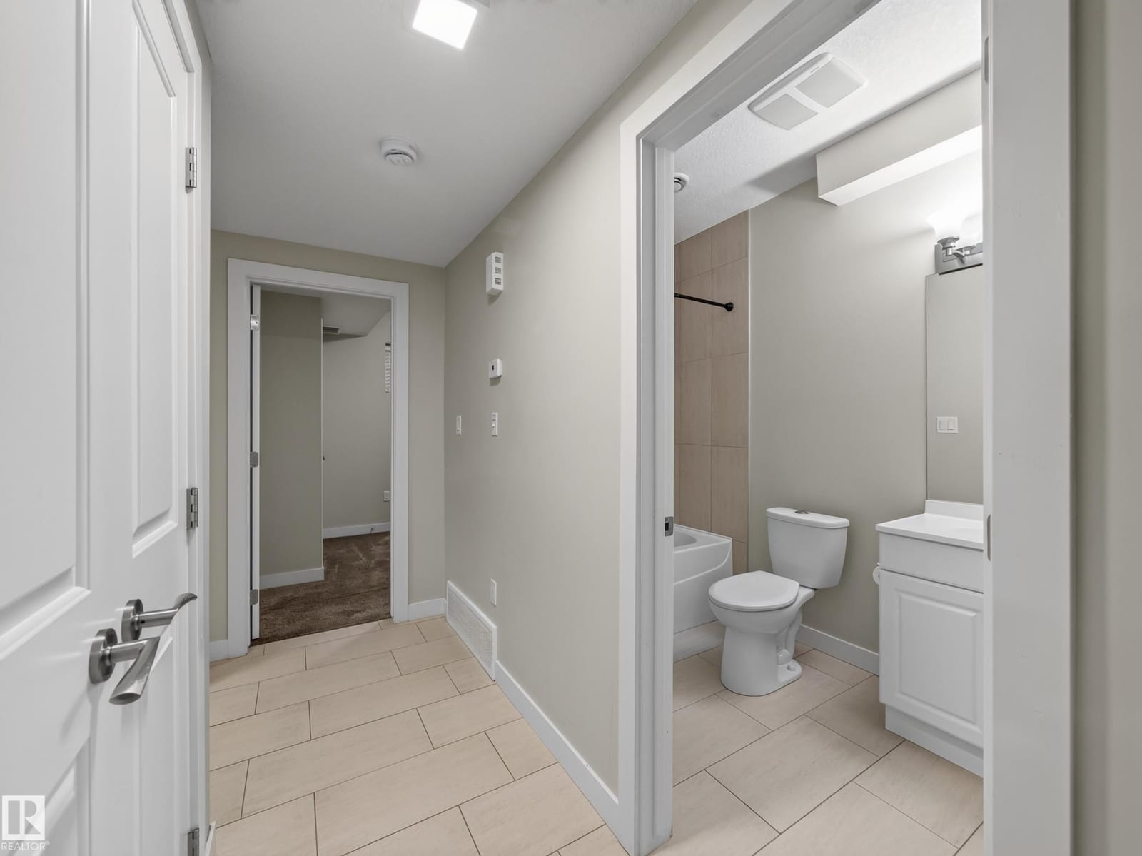 Lower-level two-piece bath off the hallway