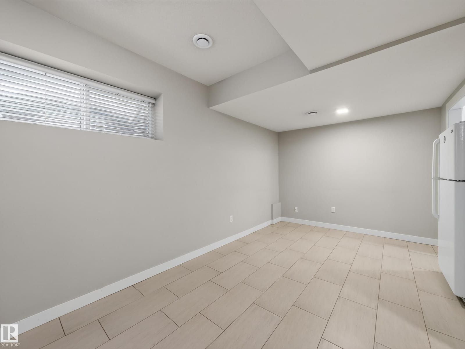 Suite living area with tile flooring