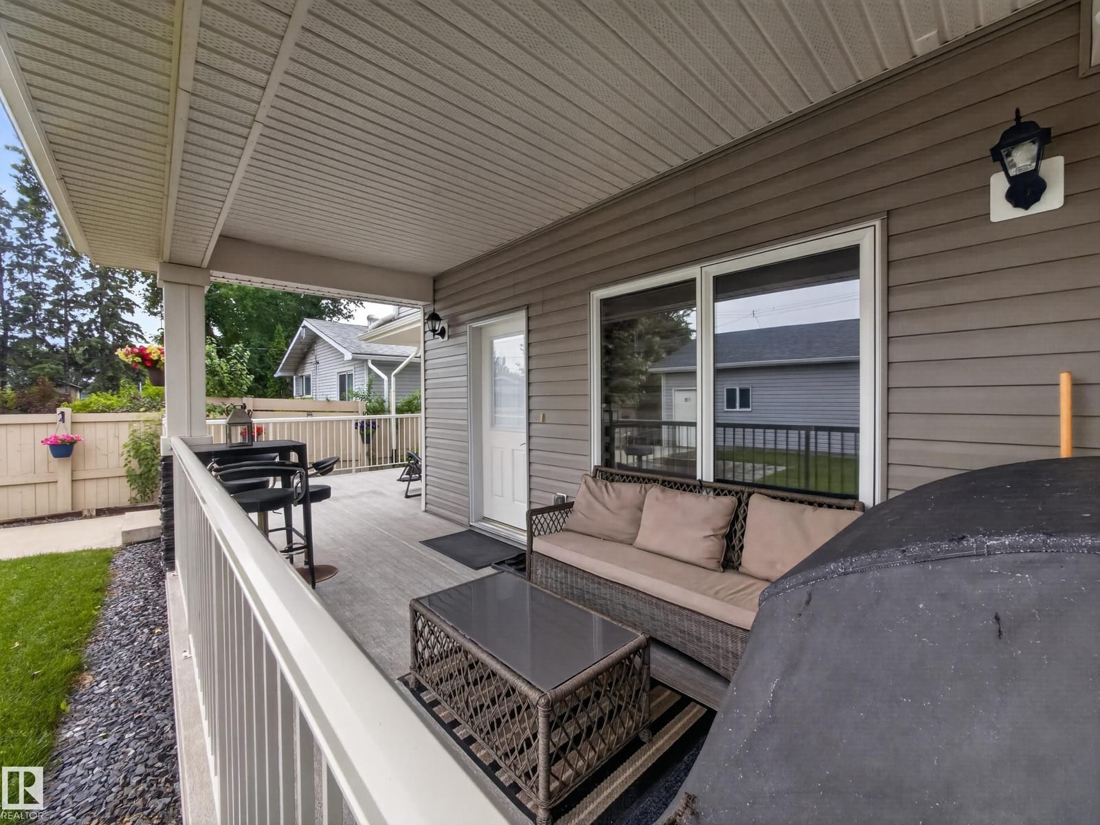 Covered rear deck with barbecue and seating