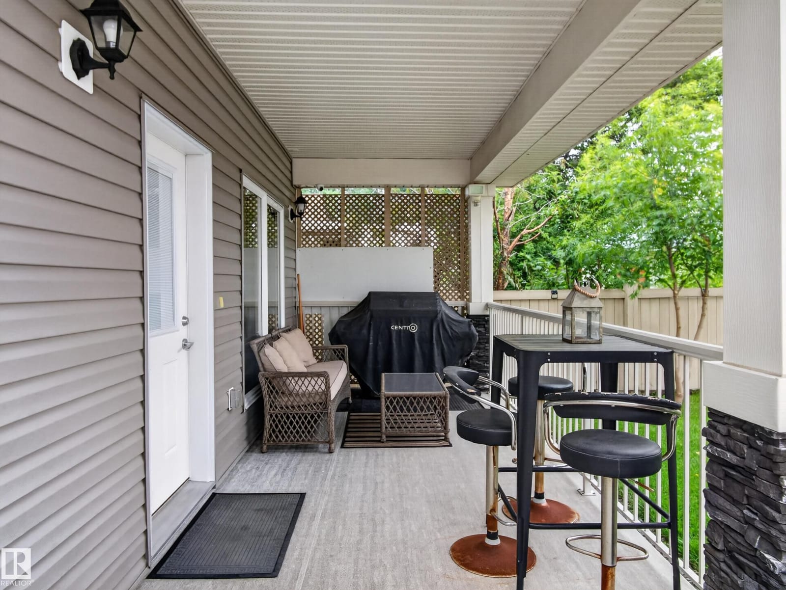 Covered deck beside the rear entry door