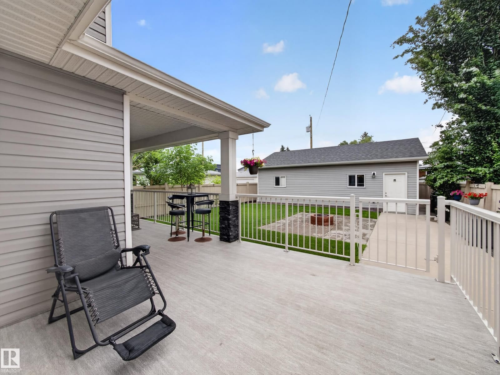 Deck looking toward the triple detached garage