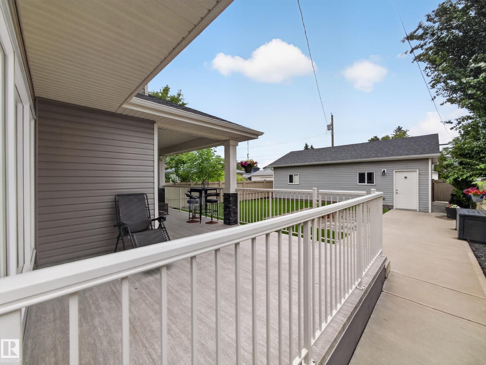 Deck railing with the garage in view
