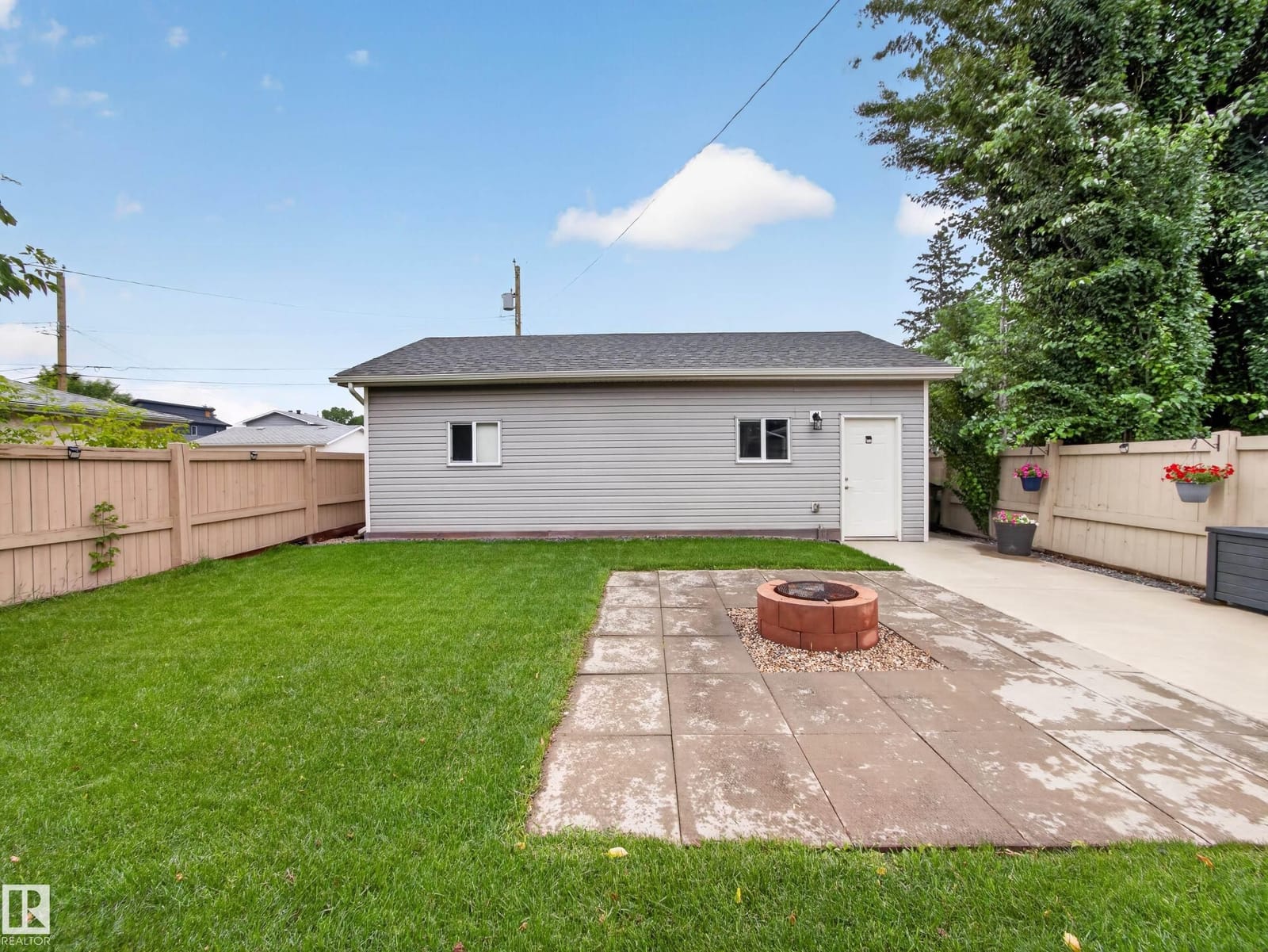 Triple detached garage across the back lawn
